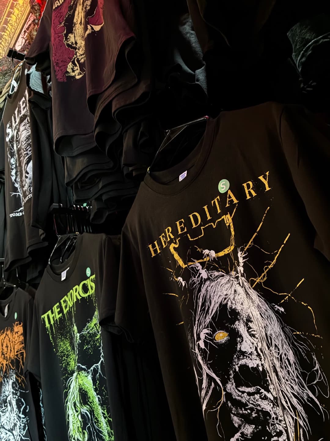 Apparel and prints on the racks inside Tomb Gallery in Salem