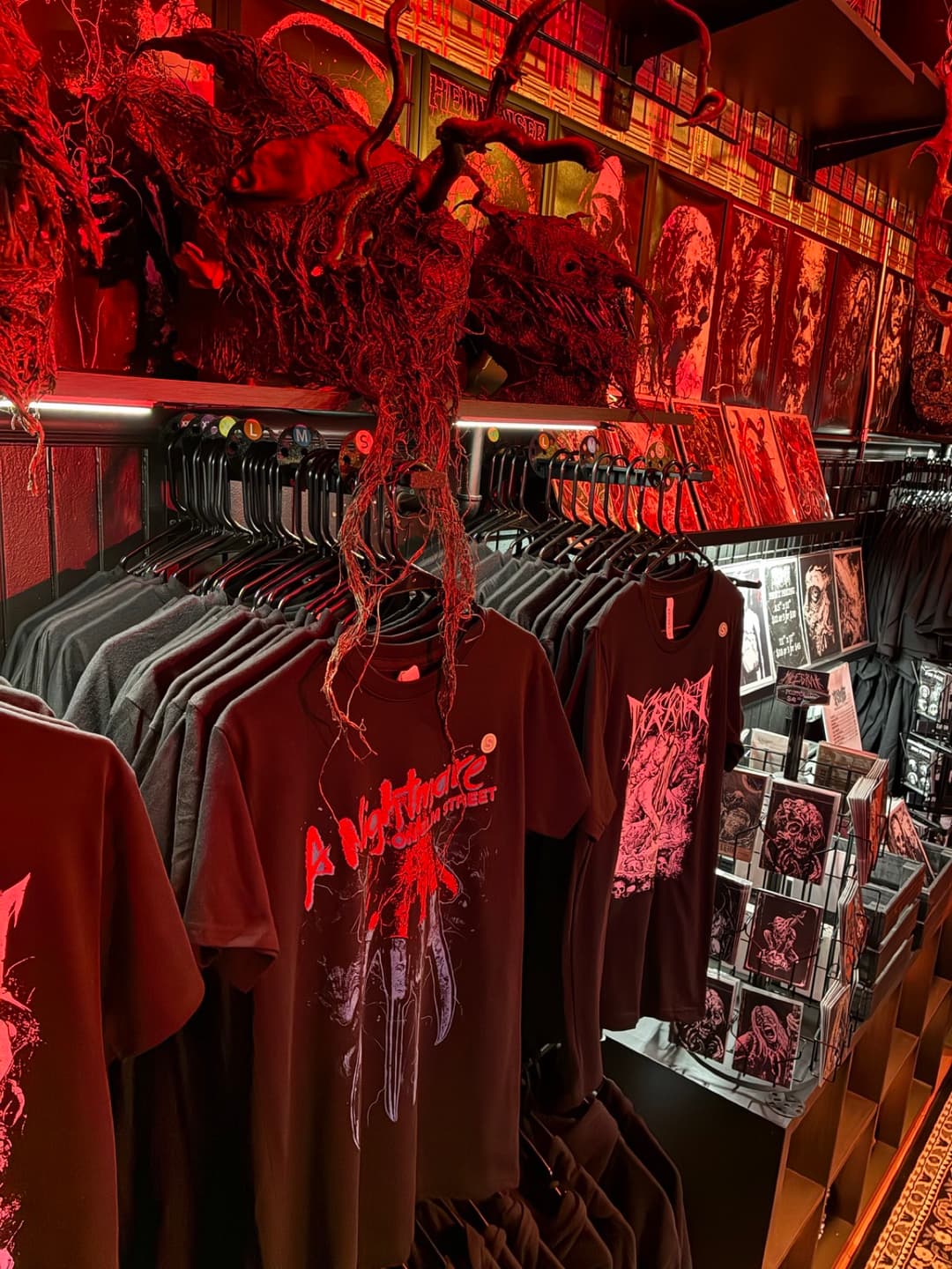 Apparel and prints on the racks inside Tomb Gallery in Salem