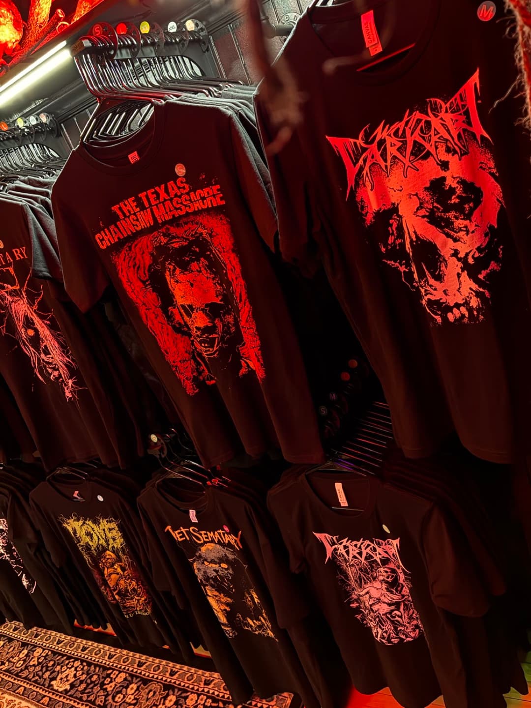 Apparel and prints on the racks inside Tomb Gallery in Salem