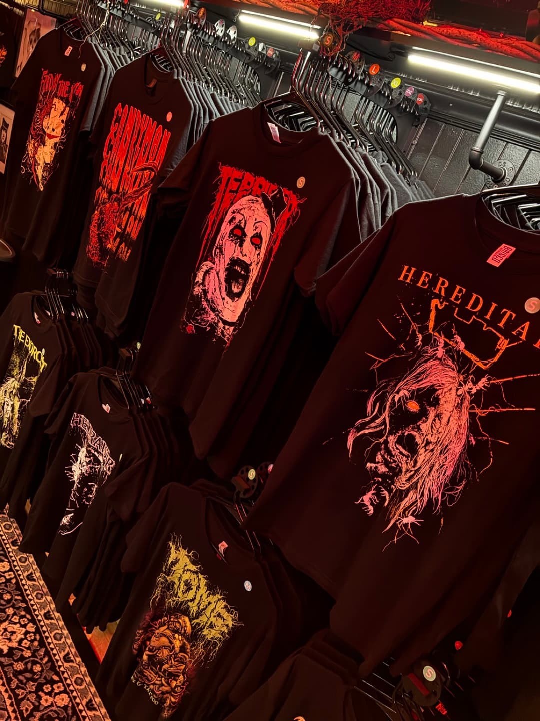 Apparel and prints on the racks inside Tomb Gallery in Salem