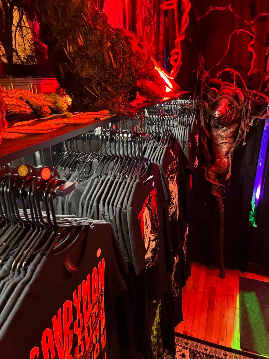 Apparel and prints on the racks inside Tomb Gallery in Salem