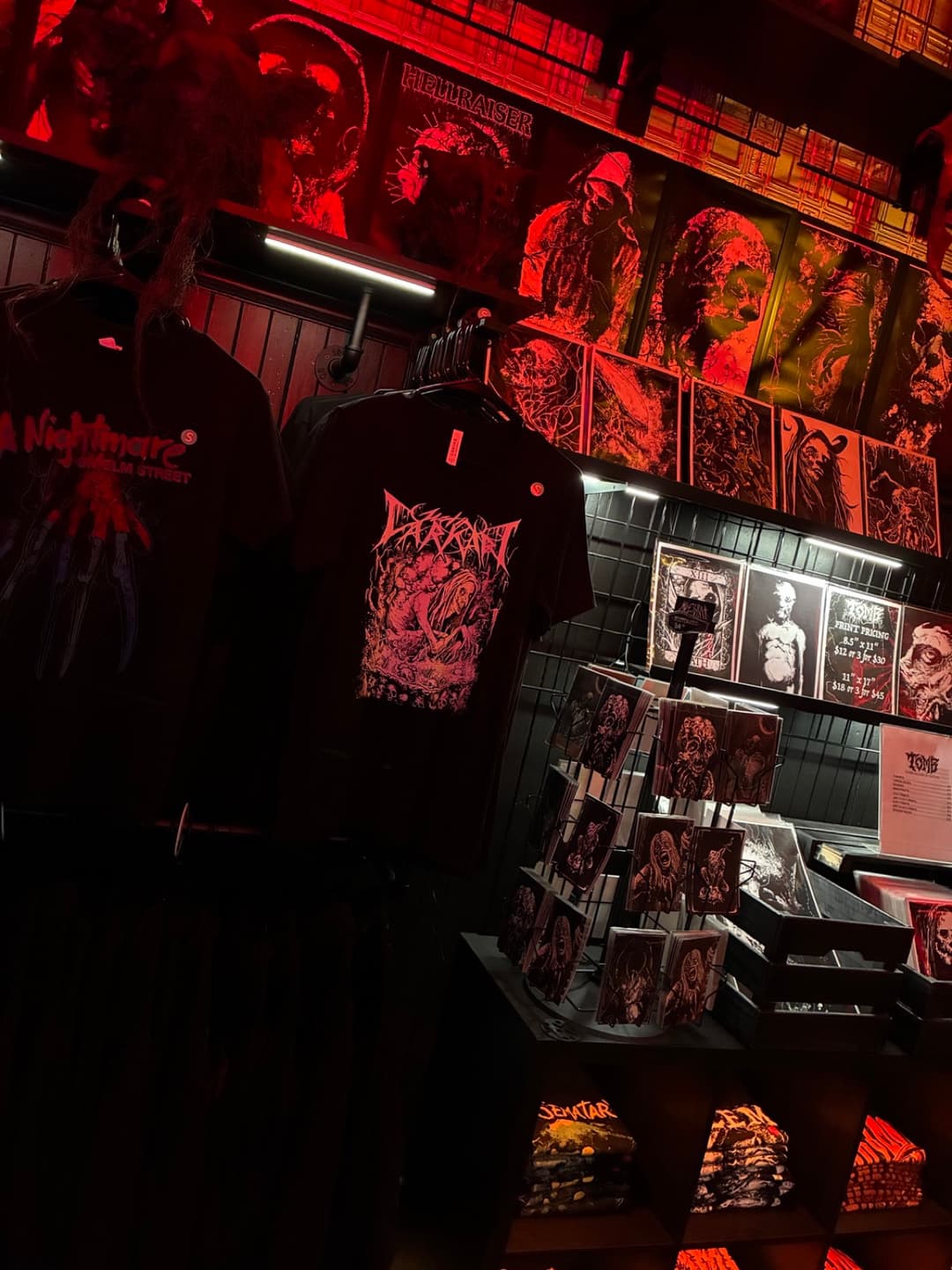 Apparel and prints on the racks inside Tomb Gallery in Salem