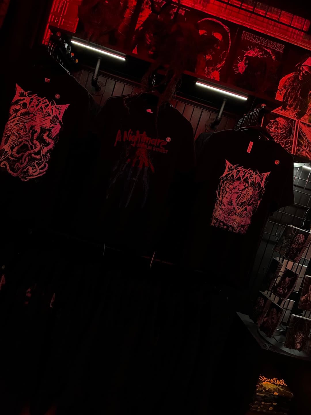 Apparel and prints on the racks inside Tomb Gallery in Salem
